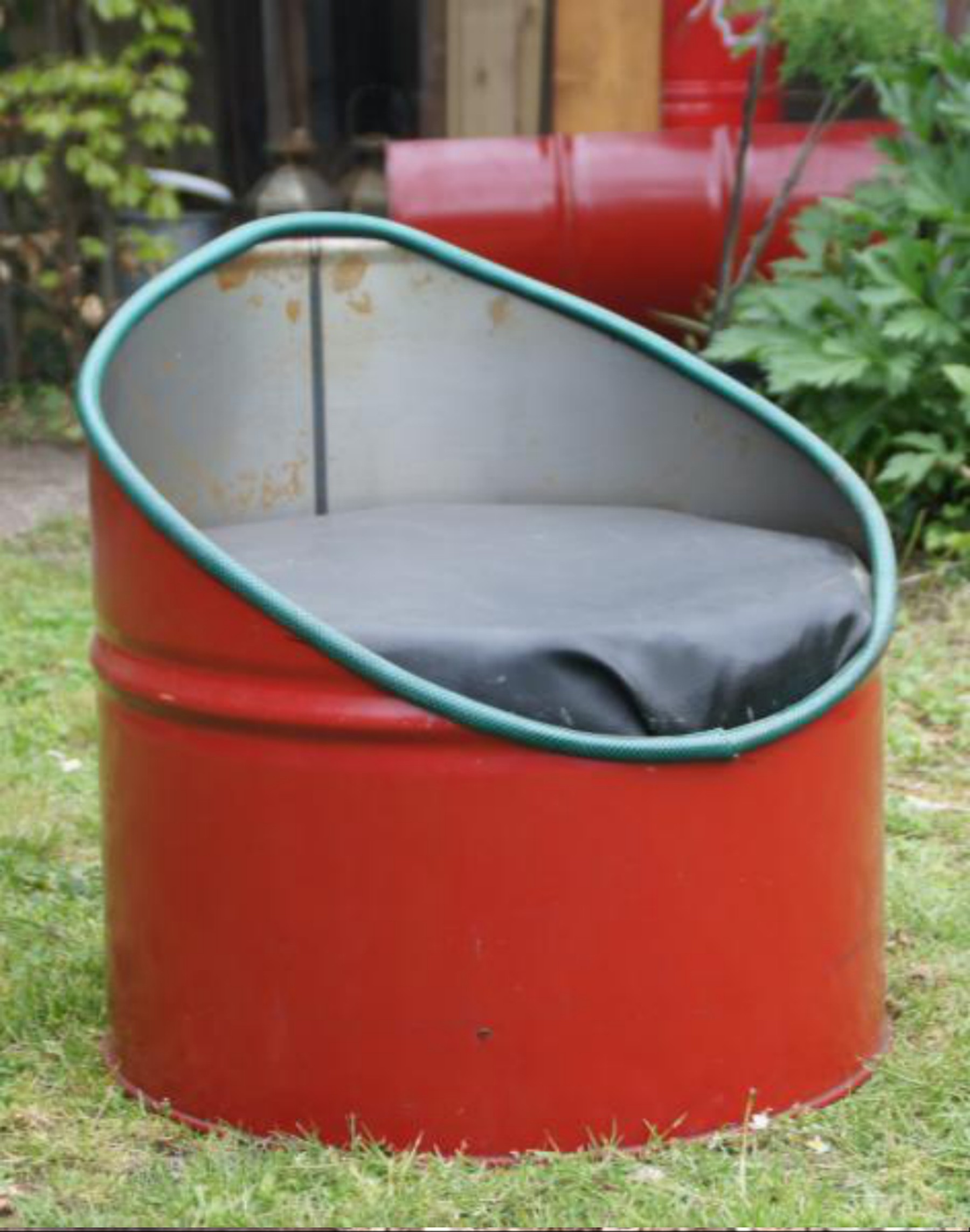 Finished chair made from an oil drum, in the garden